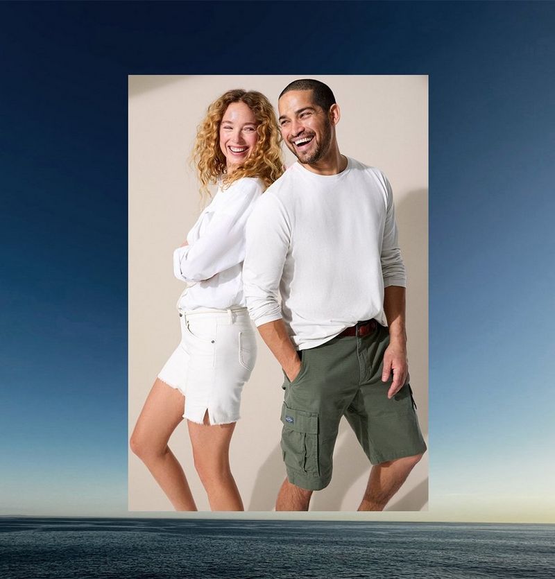 Couple standing in front of wall wearing Lee shorts.