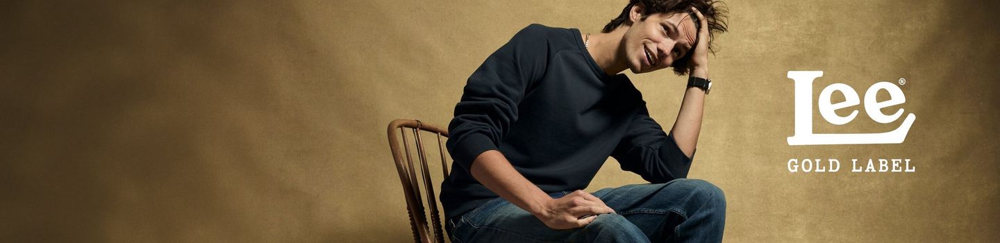 IMAGE FEATURING A MODEL SITTING ON A CHAIR WEARING THE NEW LEE GOLD LABEL PRODUCTS 