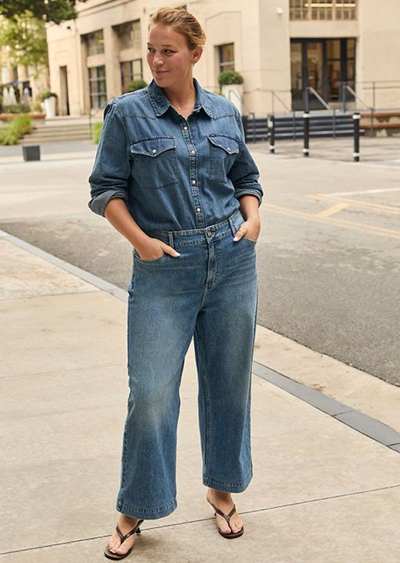 Woman in the city wearing bestselling lee denim. 