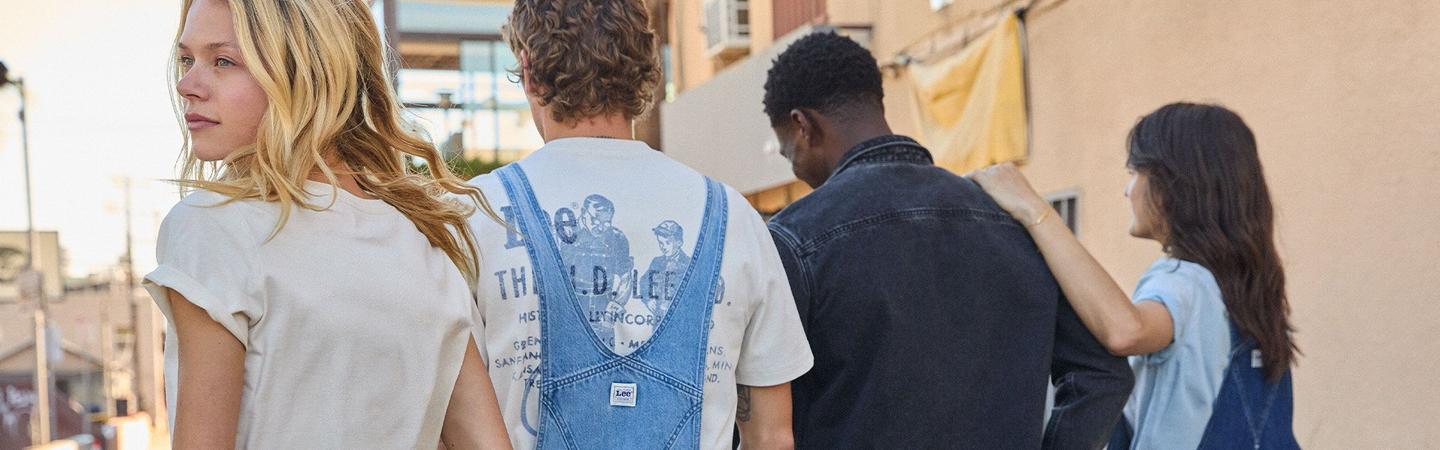 A group of people casually walking down the street, showcasing their Lee Jeans in a vibrant urban setting. Image used as the header of the Blog page.